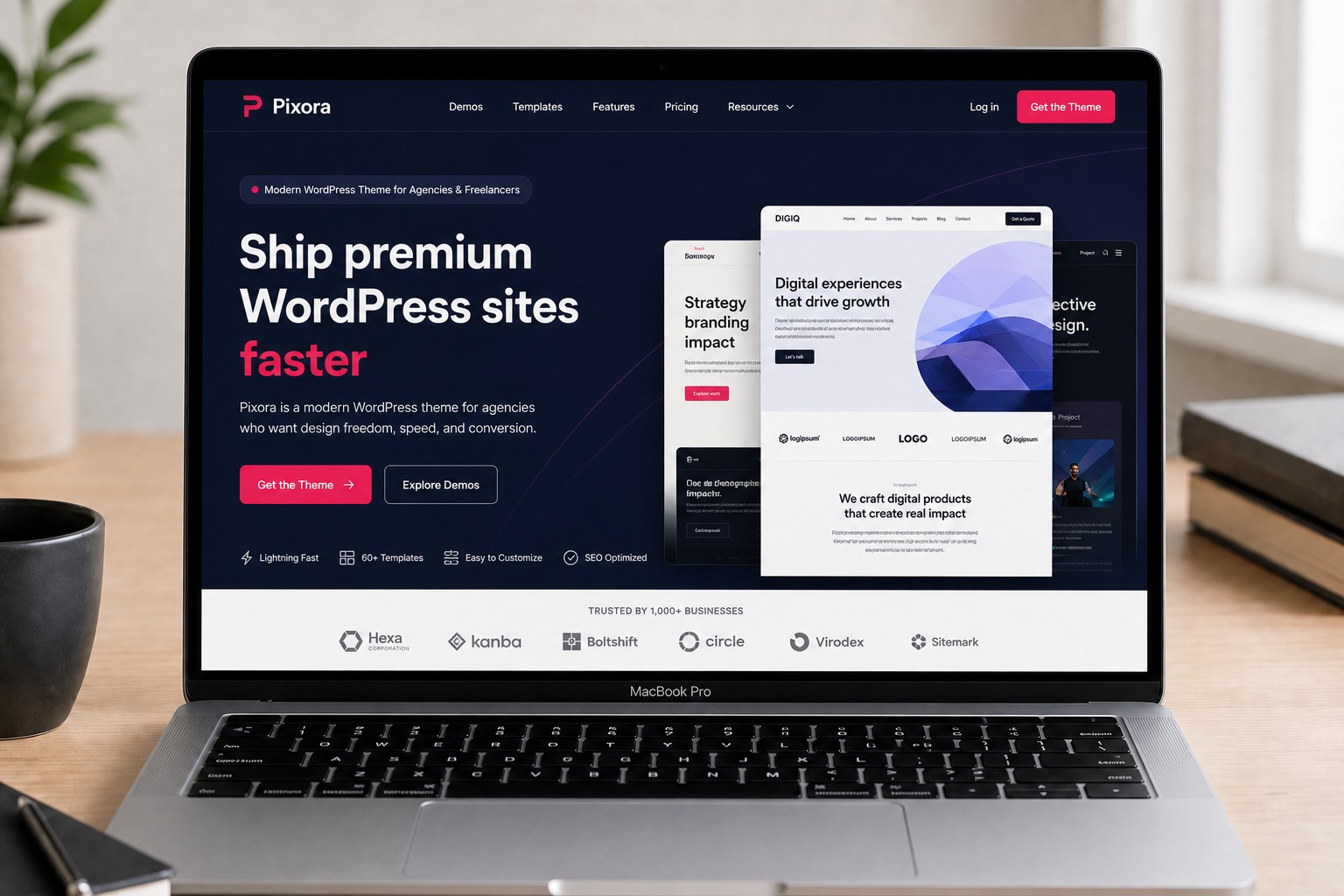 MacBook showing the Pixora WordPress theme homepage