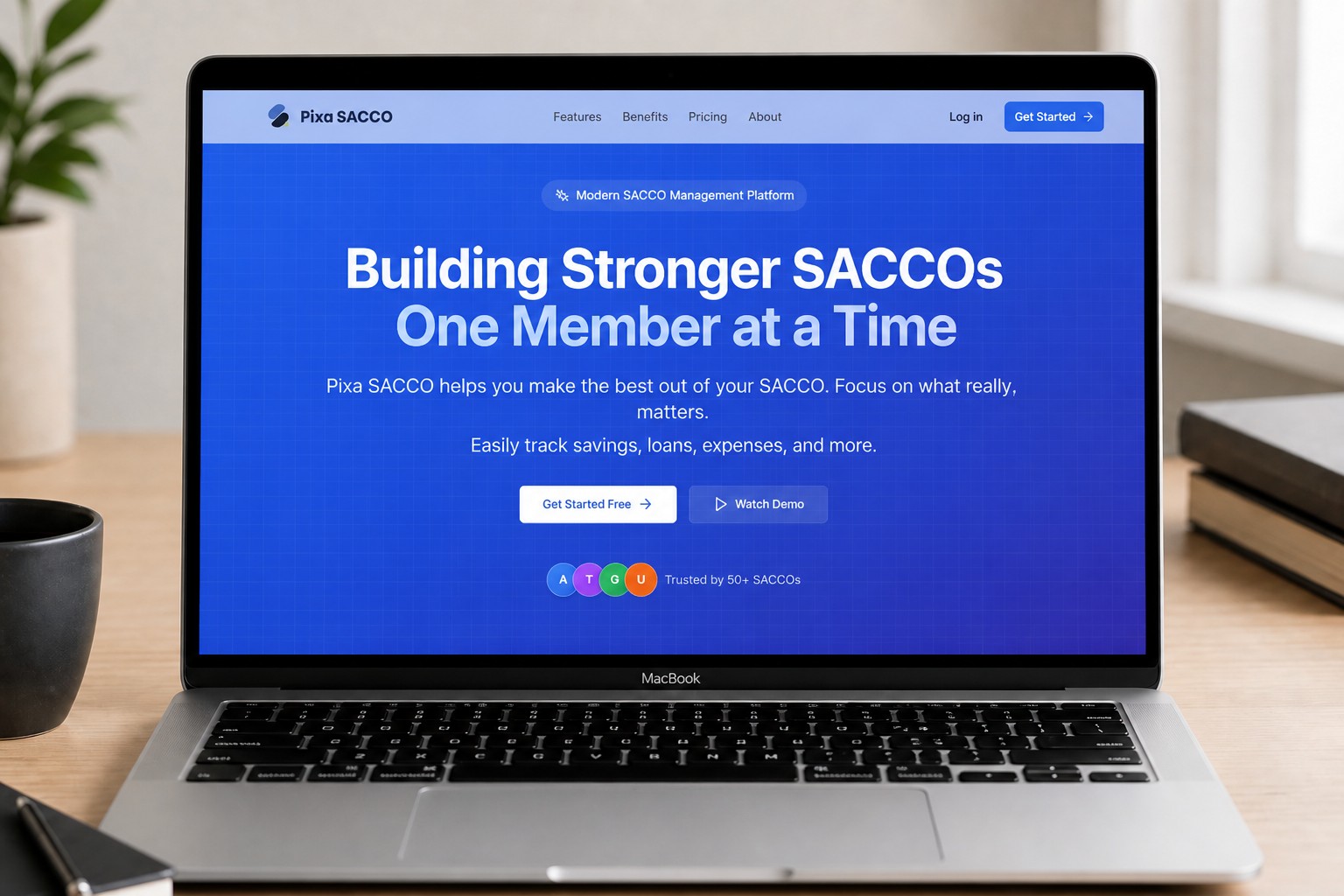 MacBook showing the Pixa SACCO management platform